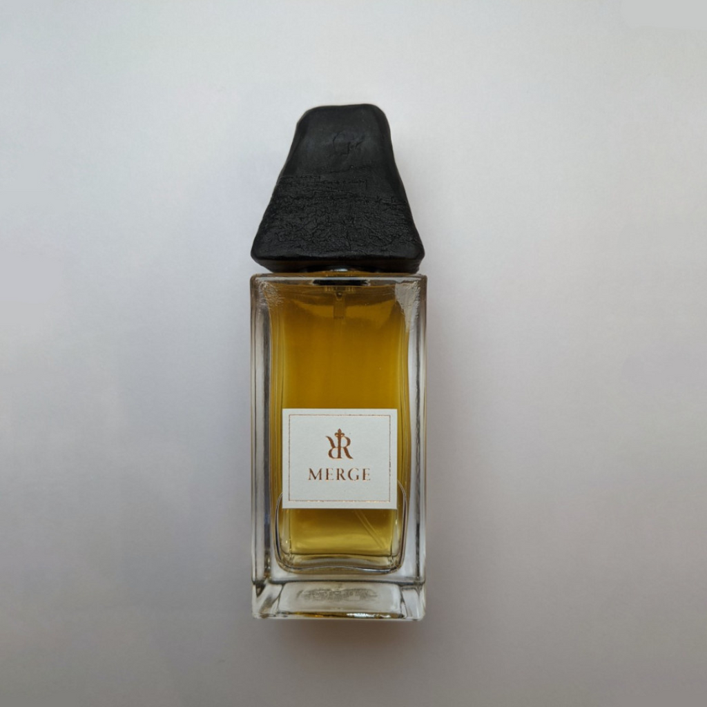 50ml bottle of niche perfume Merge; an amber perfume for women and men. 