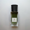 Aquatic Niche Perfume Hide shown with its green colour and sculpted bottle top.